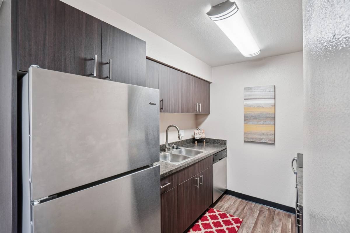 Renovated kitchen with stainless appliances in an Aspenleaf apartment