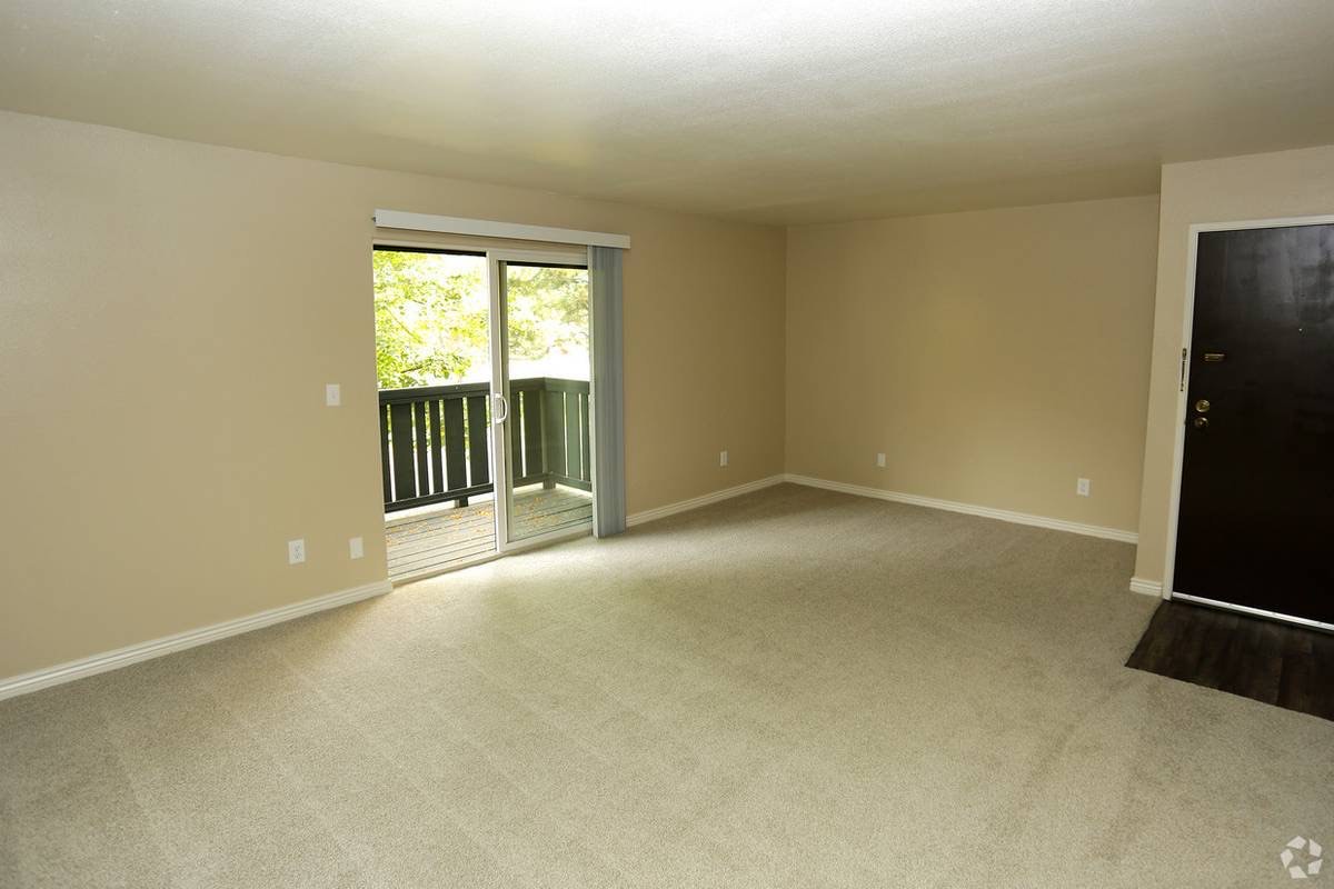 Living room with sliding door to a private balcony